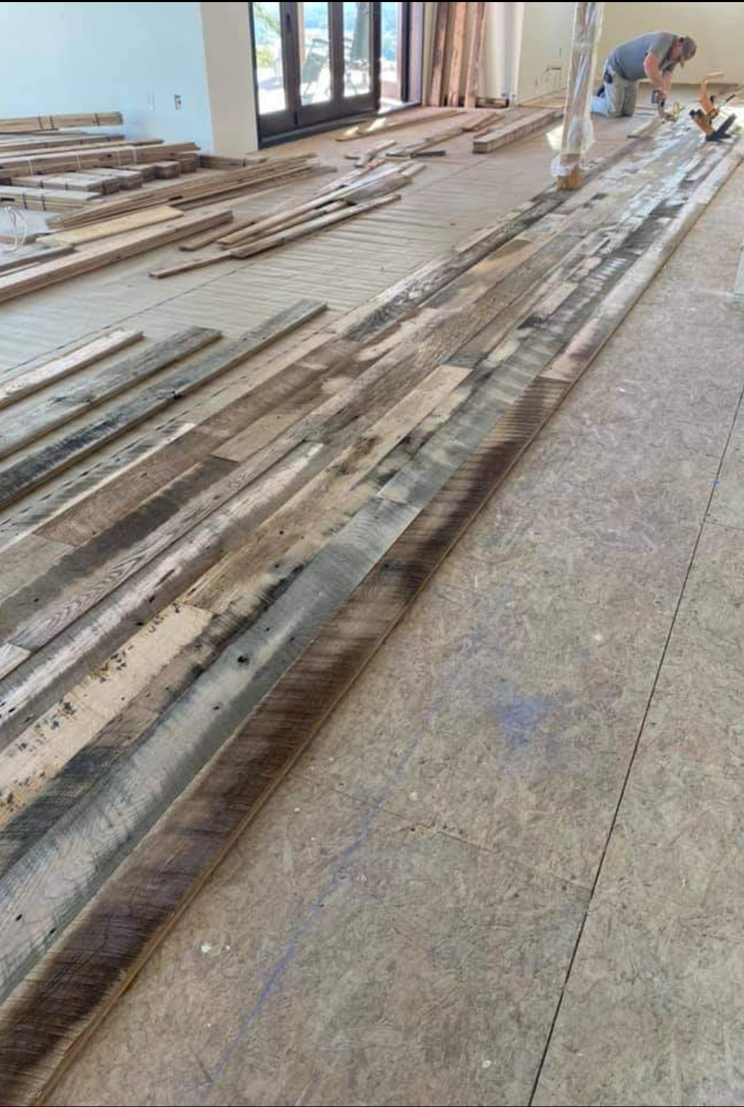 Staggered row of 3, 4, and 5, inch Reclaimed Red Oak Barn Wood Floor